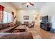 Bright and airy living room featuring a spacious layout, comfortable seating, and an open connection to the dining area at 2599 E San Mateo Dr, Casa Grande, AZ 85194