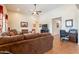 Spacious living room featuring a ceiling fan and tile flooring at 2599 E San Mateo Dr, Casa Grande, AZ 85194