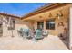 Inviting patio offers a relaxed atmosphere with a stone floor and a vibrant outdoor seating area at 2599 E San Mateo Dr, Casa Grande, AZ 85194