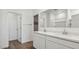 Modern bathroom featuring double vanity, white cabinets and tile floor at 2640 W Stanton Ave, Apache Junction, AZ 85120