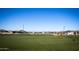 Large green space, perfect for recreation and activities, with community homes in the distance at 3279 W Molino Rd, San Tan Valley, AZ 85144