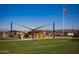 A shaded playground features modern equipment and a safe play area for children in the community at 3279 W Molino Rd, San Tan Valley, AZ 85144