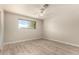 This bedroom features wood-look floors, neutral paint, and a ceiling fan at 3307 E Roveen Ave, Phoenix, AZ 85032