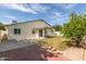 Back of home with patio and lush green grass at 3307 E Roveen Ave, Phoenix, AZ 85032
