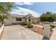 Single-story home with a desert landscaping and an inviting entryway at 3307 E Roveen Ave, Phoenix, AZ 85032
