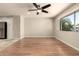 Bright living room with hardwood floors and lots of natural light at 3307 E Roveen Ave, Phoenix, AZ 85032