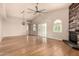 Bright living area boasting wood floors, high ceilings, and modern light fixture at 3307 E Roveen Ave, Phoenix, AZ 85032