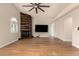 Open living room with custom wood accent fireplace and hardwood floors at 3307 E Roveen Ave, Phoenix, AZ 85032