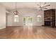 Spacious living room with hardwood floors and a fireplace feature at 3307 E Roveen Ave, Phoenix, AZ 85032