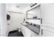 Bathroom featuring a sleek vanity, mirror, and combination shower and tub at 3330 E Cypress St, Phoenix, AZ 85008