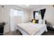 Bright bedroom featuring a modern decor, comfortable bed and plenty of natural light at 3330 E Cypress St, Phoenix, AZ 85008