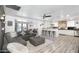 Open-concept living area with modern furnishings, adjoining kitchen and dining spaces at 3330 E Cypress St, Phoenix, AZ 85008