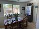 Bright dining room with wooden table and chairs, and garden view at 3341 E Cochise Rd, Phoenix, AZ 85028