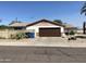 Front of home view with garage and desert landscaping at 3341 E Cochise Rd, Phoenix, AZ 85028