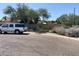 Neighborhood street view with desert landscaping and mature trees at 3341 E Cochise Rd, Phoenix, AZ 85028
