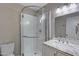 Bathroom featuring a glass door shower, a marble countertop sink, and modern fixtures at 3491 N Arizona Ave # 174, Chandler, AZ 85225