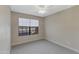 Neutral bedroom featuring updated carpeting, a window, and a ceiling fan at 3491 N Arizona Ave # 174, Chandler, AZ 85225