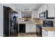 The modern kitchen has stainless steel appliances, sleek counter tops, and ample cabinet space at 3491 N Arizona Ave # 174, Chandler, AZ 85225