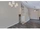 A living room with an open floor plan with a ceiling fan and stairs to the second floor at 3491 N Arizona Ave # 174, Chandler, AZ 85225