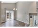 A well-lit room with hard surface flooring and a chandelier offers modern elegance and warmth to the space at 3491 N Arizona Ave # 174, Chandler, AZ 85225