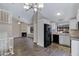 This kitchen/living space features modern design and stainless steel appliances with a gas burning fireplace at 3491 N Arizona Ave # 174, Chandler, AZ 85225