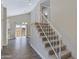 Bright interior view with tile flooring, a carpeted staircase, and vaulted ceiling near the dining area at 3491 N Arizona Ave # 174, Chandler, AZ 85225