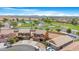Beautiful aerial view showcasing a well-maintained community, lush landscaping, and a serene pond at 36265 W Alhambra St, Maricopa, AZ 85138