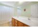 Bathroom featuring double sink vanity and a neutral tile floor and walls at 36265 W Alhambra St, Maricopa, AZ 85138