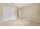 Bright bedroom features beige walls, carpet flooring and closet at 36265 W Alhambra St, Maricopa, AZ 85138