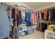 Walk-in closet offering ample storage space with racks and shelving for organized wardrobe solutions at 36265 W Alhambra St, Maricopa, AZ 85138