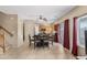 Open dining area with access to kitchen and sliding doors to the outside at 36265 W Alhambra St, Maricopa, AZ 85138