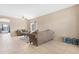 Open living area with tile floors, comfortable sofas, and natural light at 36265 W Alhambra St, Maricopa, AZ 85138