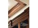 Close up on ceiling and wooden cabinets showcasing intricate carvings at 3731 E Halifax Cir, Mesa, AZ 85205
