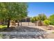 Charming home featuring a black metal gate, stone accents, and a brick driveway at 3731 E Halifax Cir, Mesa, AZ 85205