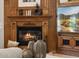 Close up of the wood burning fireplace and built-ins in the living room at 3731 E Halifax Cir, Mesa, AZ 85205