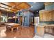 Stunning game room featuring a beautiful pool table, custom ceiling, bar area, and hardwood floors for a luxurious entertainment space at 3731 E Halifax Cir, Mesa, AZ 85205