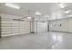 Spacious four-car garage with ample storage and side entry door. Modern lighting throughout at 3731 E Halifax Cir, Mesa, AZ 85205