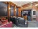 This home has a beautiful home theater with comfortable seating, custom lighting, and a large screen for immersive viewing at 3731 E Halifax Cir, Mesa, AZ 85205