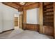 Spacious living room featuring custom wood trim, built-ins, and neutral carpet at 3731 E Halifax Cir, Mesa, AZ 85205