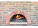 The outdoor brick pizza oven is fired up and ready to make something special at 3731 E Halifax Cir, Mesa, AZ 85205