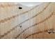 Close-up view of the shower featuring designer tile with a diagonal pattern on the walls at 3731 E Halifax Cir, Mesa, AZ 85205