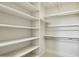 Walk-in closet featuring ample shelving and hanging space for optimal organization at 3731 E Halifax Cir, Mesa, AZ 85205