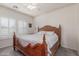 The bedroom features neutral walls, a queen bed, and shuttered windows at 40089 W Bonneau St, Maricopa, AZ 85138