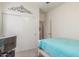 A cozy bedroom has a ceiling fan, a closet, and light walls at 40089 W Bonneau St, Maricopa, AZ 85138