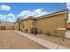 Attractive home exterior with desert landscaping, a sidewalk, and a tile roof at 40089 W Bonneau St, Maricopa, AZ 85138
