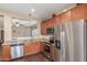 The kitchen features stainless steel appliances and an open-concept design at 40089 W Bonneau St, Maricopa, AZ 85138