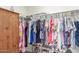 This walk-in closet features ample storage with rods and shelving, for efficient organization at 40089 W Bonneau St, Maricopa, AZ 85138