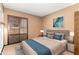 Bedroom with stylish decor, a large bed, and access to natural light at 4024 W Griswold Rd, Phoenix, AZ 85051