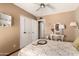 Bedroom with neutral-toned walls, closet, and a vintage inspired vanity at 4024 W Griswold Rd, Phoenix, AZ 85051
