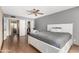 Spacious bedroom with a white bed, ceiling fan, and a large walk-in closet at 4024 W Griswold Rd, Phoenix, AZ 85051